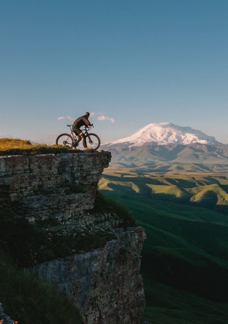 Cyclist on scenic cliff route